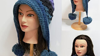 Mannequin displays blue and purple crocheted hat with large pom-poms; one view shows a matching scarf, highlighting texture.