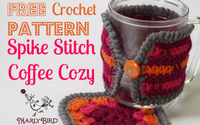Promotional image displaying a crochet coffee cozy with a spike stitch pattern in vivid colors wrapped around a clear mug of tea, with the text "Free Crochet Pattern Spike Stitch Coffee Cozy" by Marly Bird. -Marly Bird
