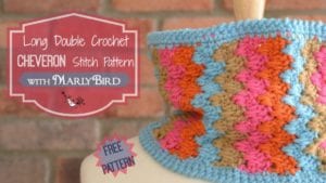 A colorful crocheted chevron pattern on fabric, displayed on a mannequin with a brick background. Text overlays announce a free pattern by Marly Bird. -Marly Bird