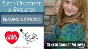 Split image featuring a left side with text "Let's Crochet A Sweater" and a sweater diagram, and the right side showing a woman in a multi-colored crocheted sweater, smiling. Red Heart Yarn logo at the bottom. -Marly Bird