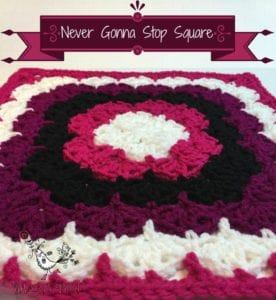 A crochet square featuring concentric circles in cream, pink, magenta, and black colors, named "Never Gonna Stop Square." The background is a white surface with a light pink watermark logo at the bottom. -Marly Bird