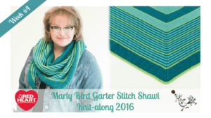 Promotional image featuring a smiling woman with glasses wearing a blue and green knitted shawl. To the right, a close-up of the shawl's pattern. Text indicates it's for a knit-along event by Red Heart, week #1, 2016. -Marly Bird