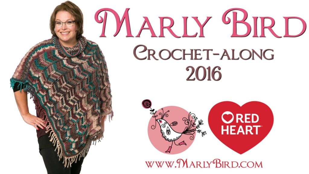 Promotional image featuring a smiling woman wearing glasses and a multicolored crochet shawl. Text reads "Marly Bird Crochet-Along 2016" with logos for Red Heart and MarlyBird.com. -Marly Bird