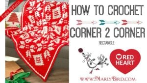 Graphic showing a red and white crochet blanket with snowflake and deer designs, accompanied by text "How to Crochet Corner to Corner Rectangle using half double crochet" and logos for "Marly Bird" and "Red Heart" yarns. -Marly Bird