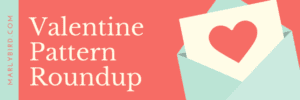 A graphic banner featuring the text "Valentine Pattern Roundup" on a red background, with a heart on an envelope in the corner and the website "MarlyBird.com" displayed. -Marly Bird