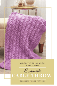 Promotional image featuring an exquisite, cable knit throw in light purple, elegantly draped over a cream sofa with a wooden side table in the background. Text includes details about a video tutorial and a free pattern. -Marly Bird