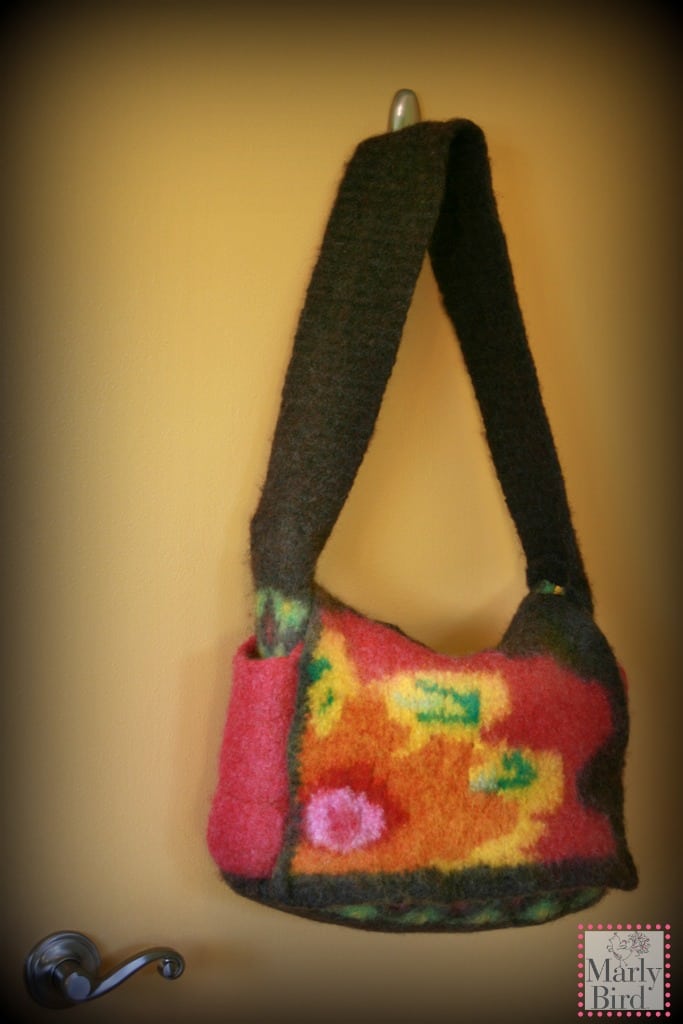 Knit felted messenger bag pattern by Marly Bird. Front flap has large flower graphic