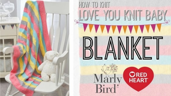 love you knit baby blanket sample draped over the back of a white rocking chair. marly bird