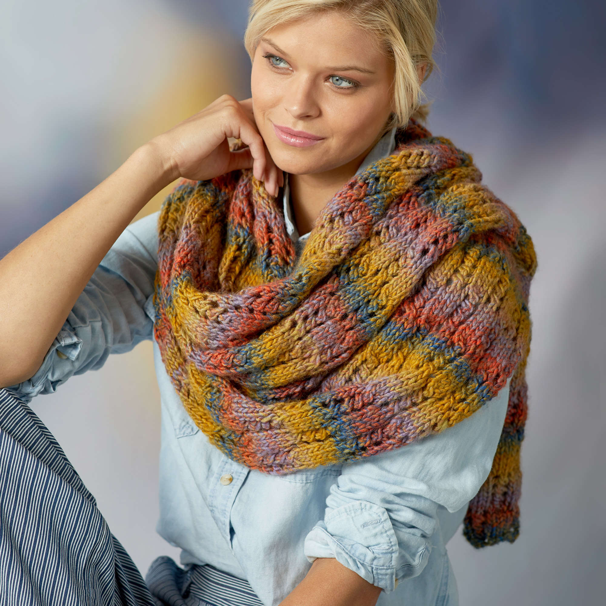 easy knit lace shawl named rendezvous draped around the shoulders and neck of a model - Marly Bird