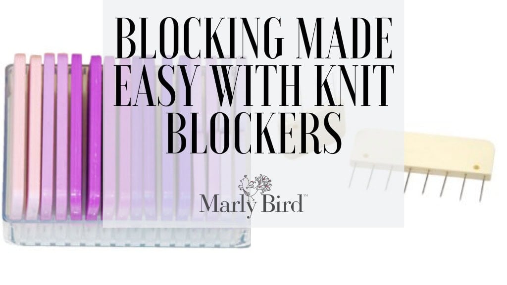 Colorful knit blockers in a clear box with one blocker out, showing metal pins for blocking knitted or Tunisian crochet pieces.