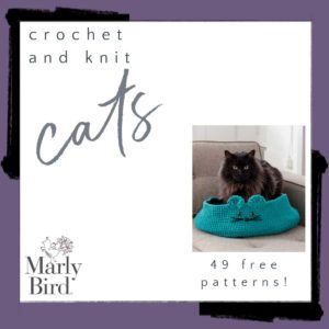 A book cover titled "crochet and knit cats" by Marly Bird, featuring a dark grey cat sitting inside a bright blue knitted bed, with text announcing "49 free crochet cat patterns!. -Marly Bird