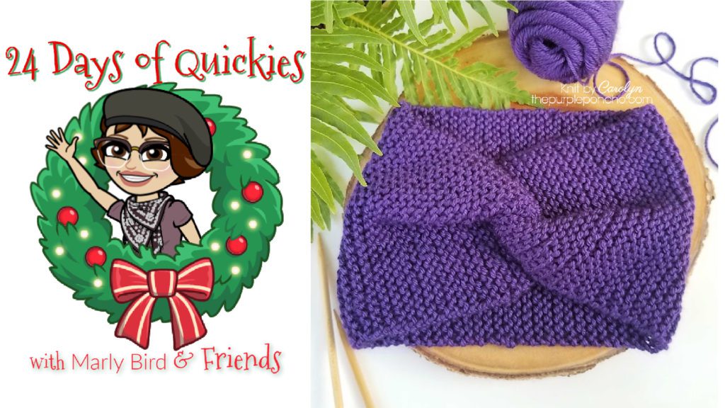 Royal purple knit garter stitch ear warmer on pine wood slice with fern.
