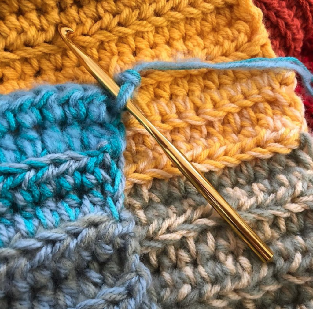Double crochet in back loop only using two yarn colors held together