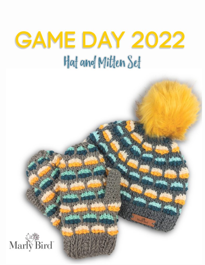 Game Day Hat & Mitten Set - Both have grey background with yellow & white, and dark and light green dashes design. Hat has bright yellow fur pompom. Triple Threat Tunisian Crochet. Marly Bird