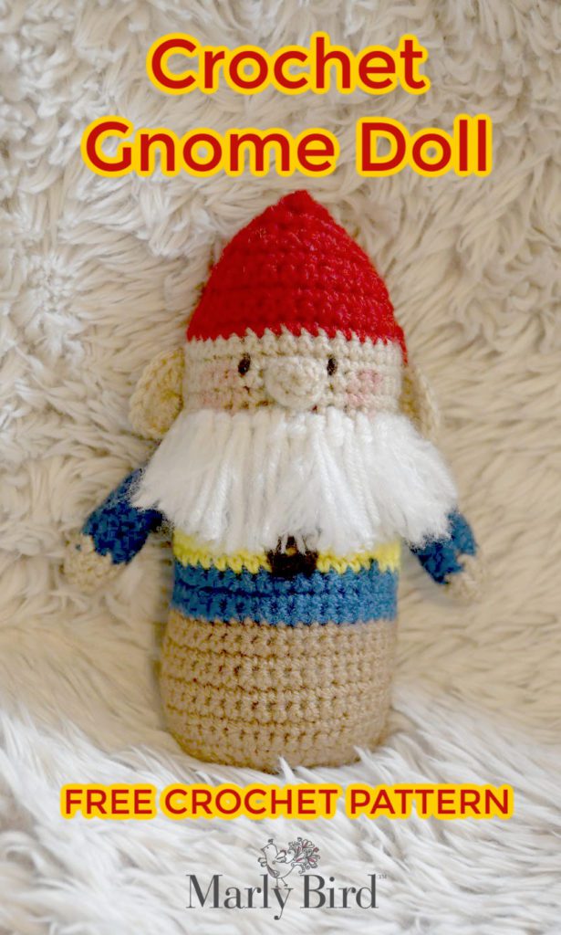 Crochet gnome doll on fur background.