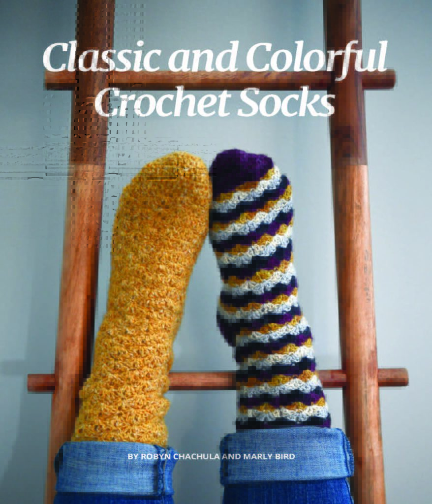 Classic and Colorful Crochet Sock Workshop by Marly Bird and Robyn Chachula - picture is of two feet wearing different crochet socks on a ladder facing up towards the ceiling - Marly Bird. Crochet with fingering weight yarn.