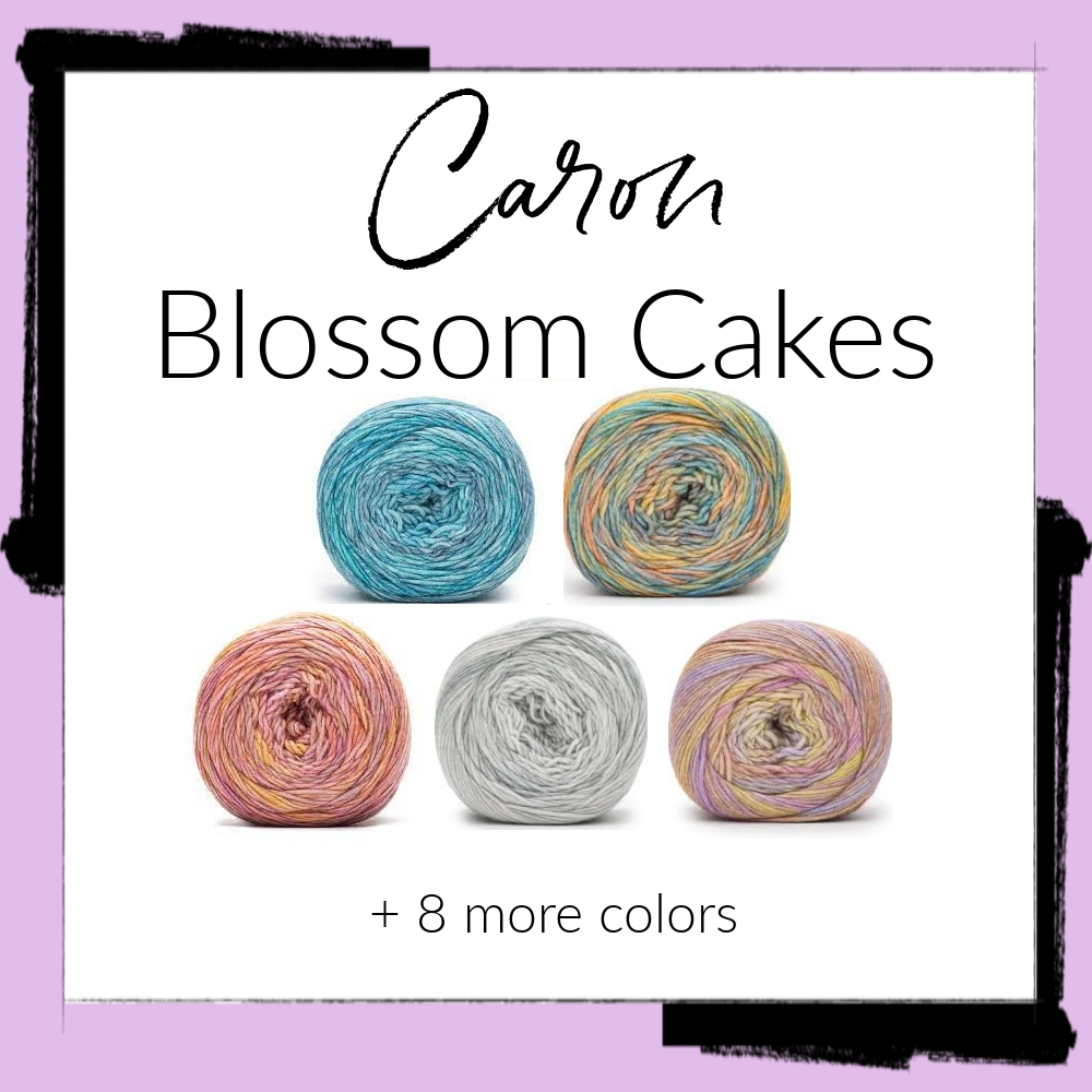 Image of 5 yarn colorways of Caron Blossom Cakes. Blues, multi, pinks, greys, pale purples.