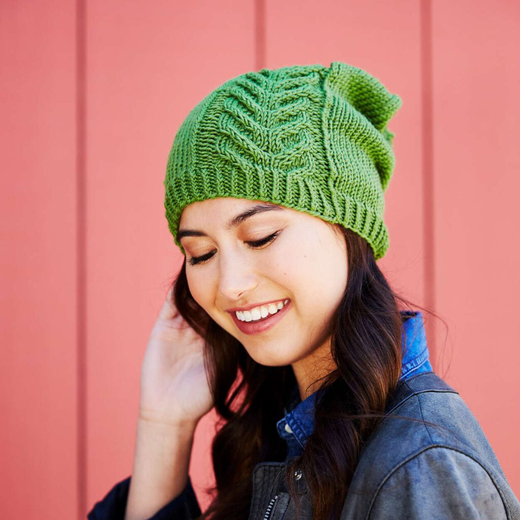 free knit and crochet saint patrick's patterns. picture of green slouchy hat with cable detail in one section of the hat. Marly Bird