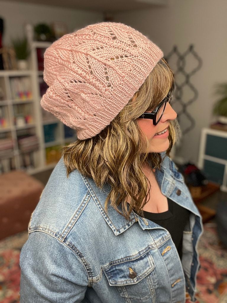 Bashful Knit Lace Hat in blush pink yarn — modeled view showing the lace pattern body and slouchy silhouette