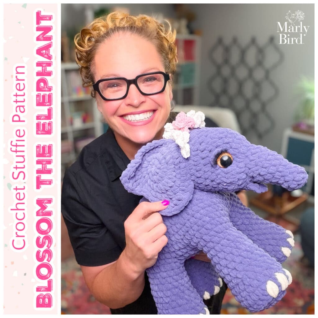 Blossom the Elephant, a free large crochet stuffed animal pattern by Megan Kreiner for MarlyBird.com, shown in purple super bulky yarn with flower crown details