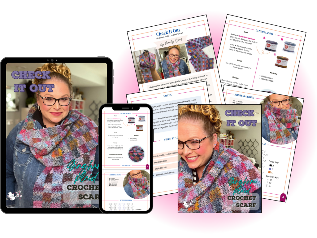 A tablet and smartphone displaying a crochet scarf pattern titled "Check It Out." Surrounded by printed pages featuring the same pattern, photos of the scarf, and instructional text. A woman wearing glasses and the scarf is smiling. Text reads "Beginner-friendly DIY Plaid Crochet Scarf - Free Pattern with Video Tutorial. -Marly Bird