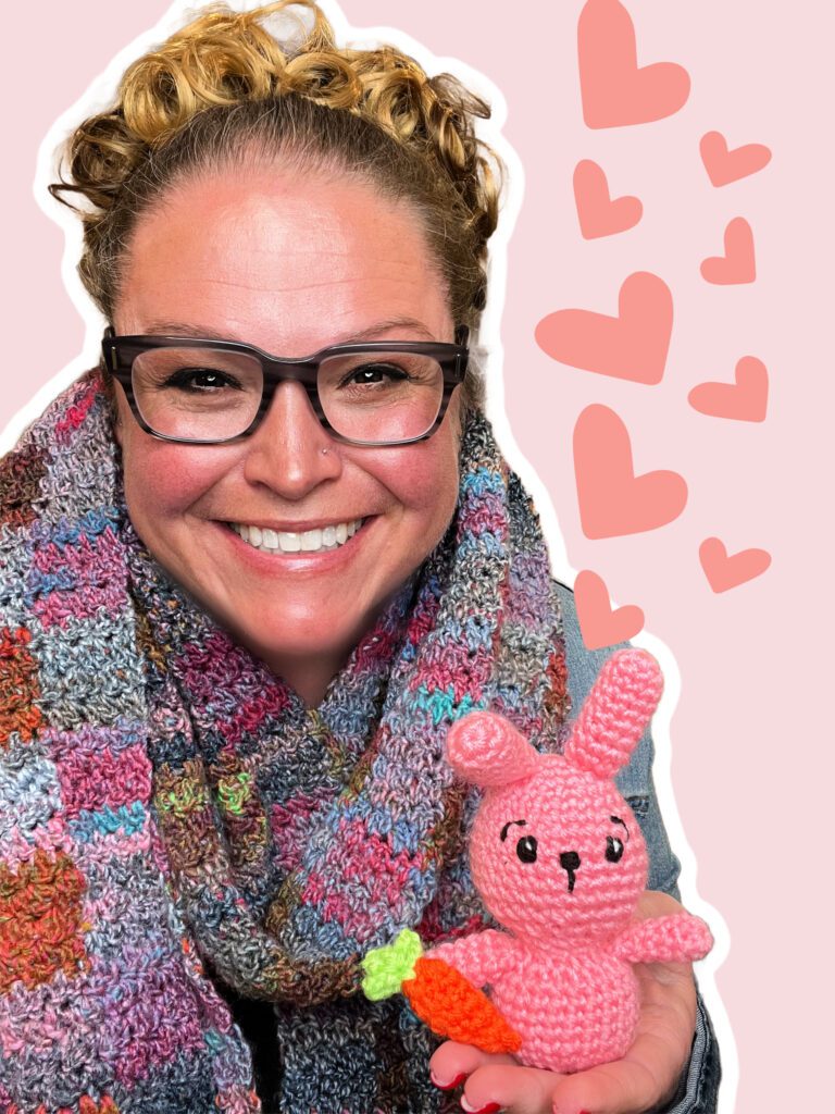 Warm smiles by Marly Bird as she holds a handmade bunny —small crochet bunny rabbit stuffed animal fits in the palm of her hand. Great for Easter baskets.
