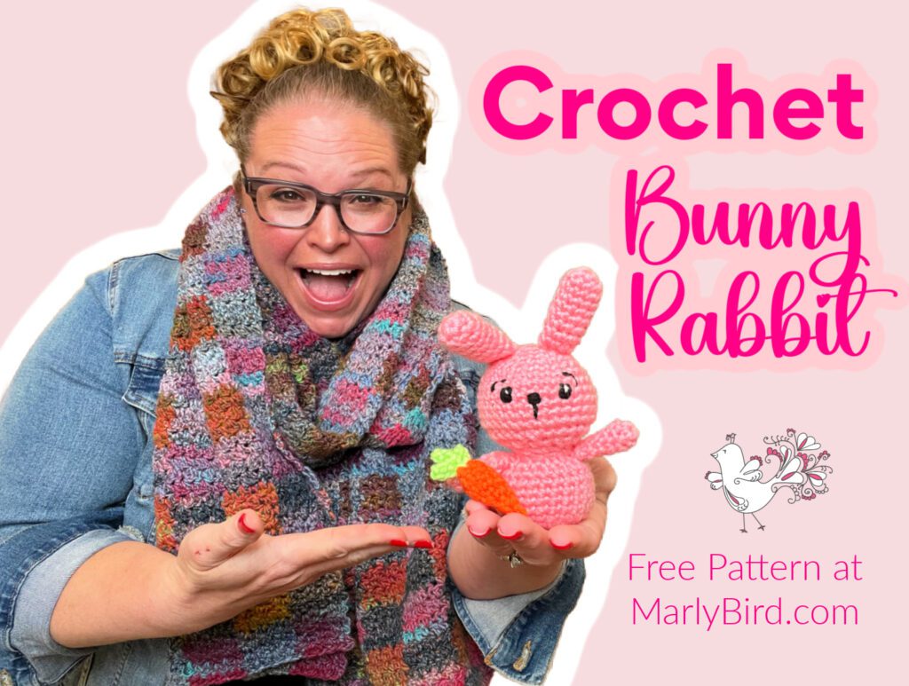 Marly Bird showcasing her adorable handmade crochet bunny rabbit stuffed animal, with a link to a free pattern available on her website.