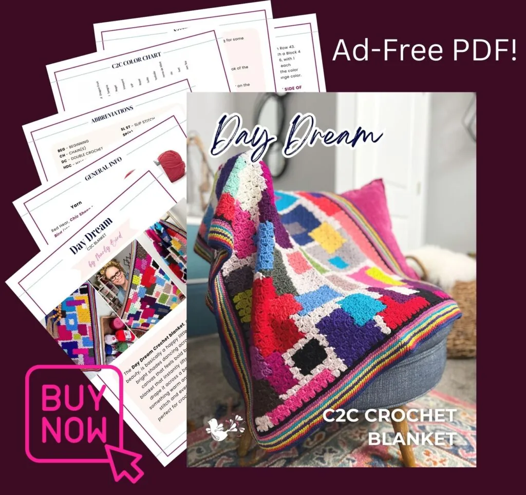 A colorful quilted crochet blanket draped over a chair, with pages of a FREE Crochet Chic Sheep Blanket pattern PDF displayed in the background. Text reads "Day Dream," "C2C Crochet Blanket," and "Ad-Free PDF! BUY NOW. -Marly Bird