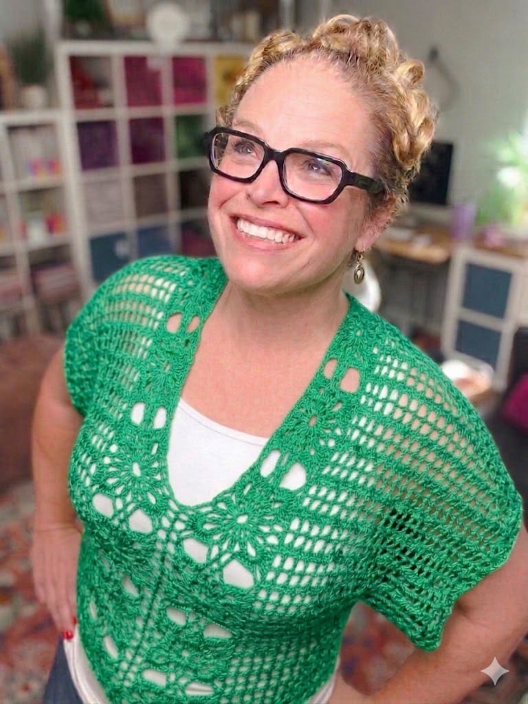 Free crochet floral motif tee pattern in emerald green — size-inclusive lacy summer crochet sweater by Marly Bird