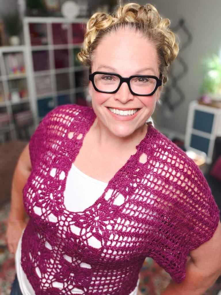 Marly Bird in the free crochet floral motif tee pattern — close-up styling of the lacy summer crochet sweater