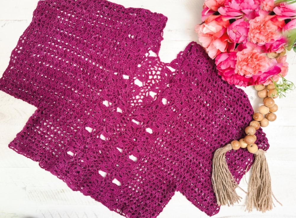 Magenta crochet floral motif tee pattern detail — close-up of intricate joined floral lace stitches
