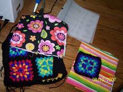 Fabric lining, plastic canvas for shaping, and handles for a granny square crochet bag - Marly Bird