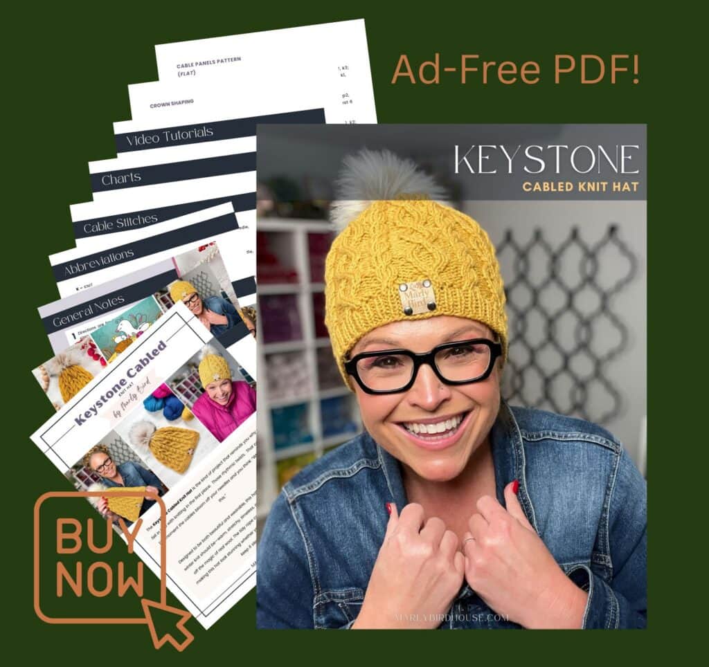 Person wearing a yellow cable knit hat, showing stitch texture; knitting pattern sample pages displayed to the left.