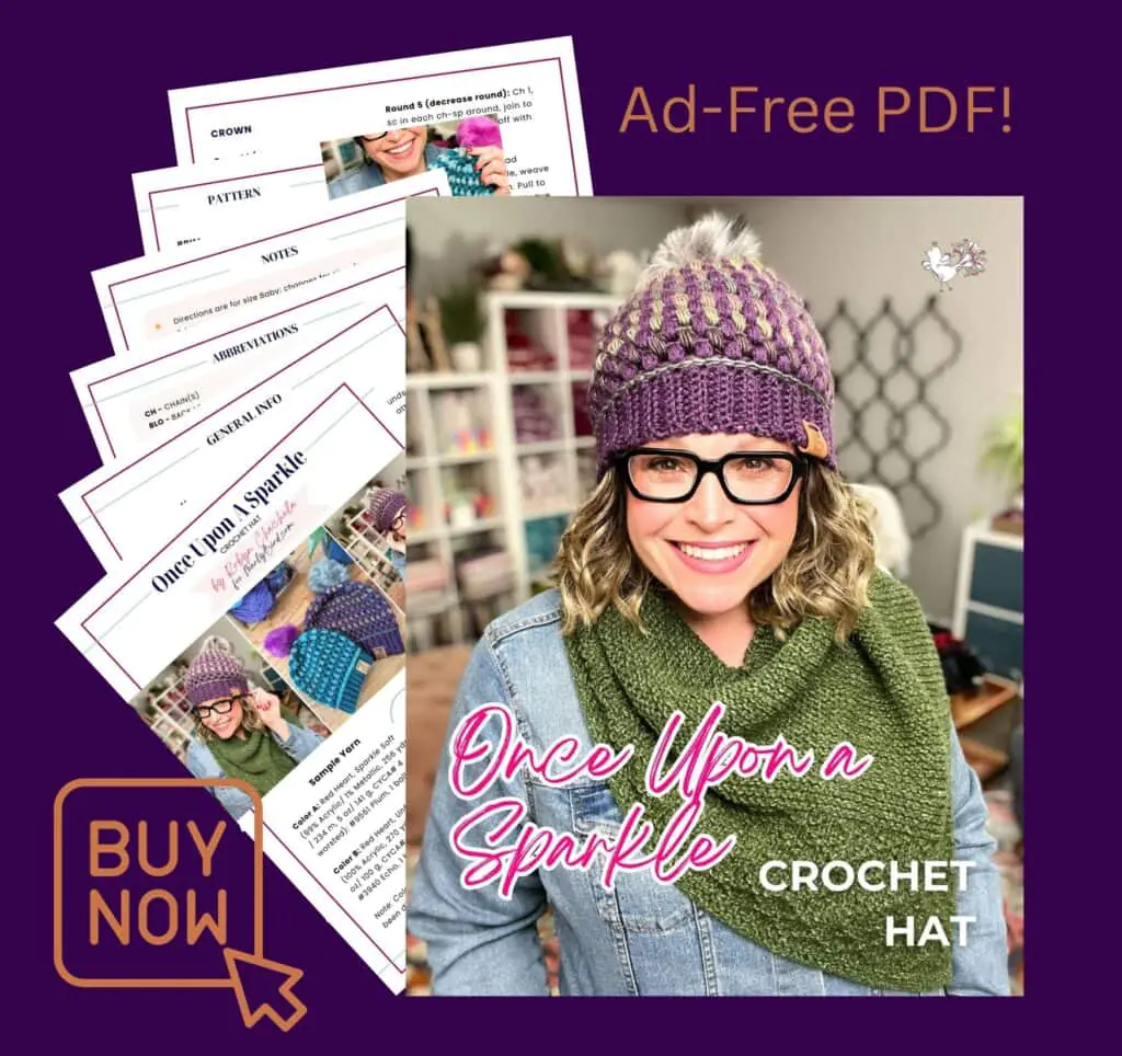 Woman models a purple crochet hat with pom-pom and textured stitches; yarn shelves in background.