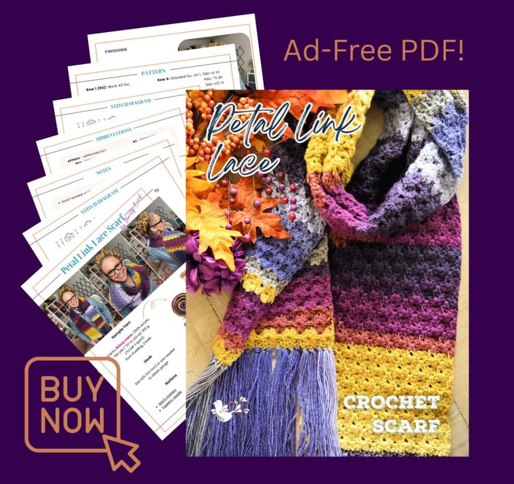 A colorful Marly Bird petal link lace scarf in purple, yellow, and gray lies on a wooden surface with autumn leaves. Overlapping printouts read “Petal Link Lace Crochet Scarf.” A “Buy Now” button and “Ad-Free PDF!” appear below. -Marly Bird