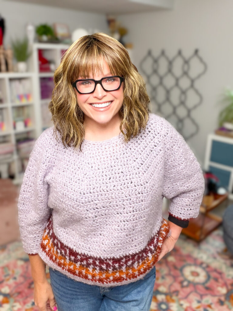 Model wearing the Pumpkin Spice mosaic crochet cropped sweater — free beginner crochet colorwork sweater pattern