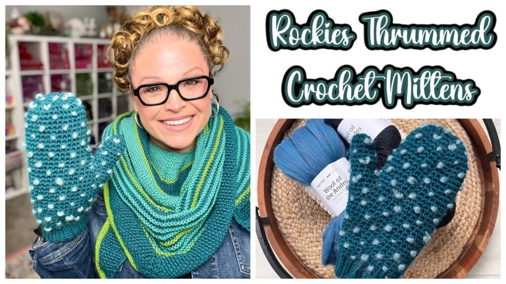 A smiling person wearing glasses and a blue-green shawl holds up a crocheted mitten. Beside them, yarn and a finished mitten are displayed. Text reads: "Rockies Thrummed Crochet Mittens – perfect for your next Make-Along. -Marly Bird