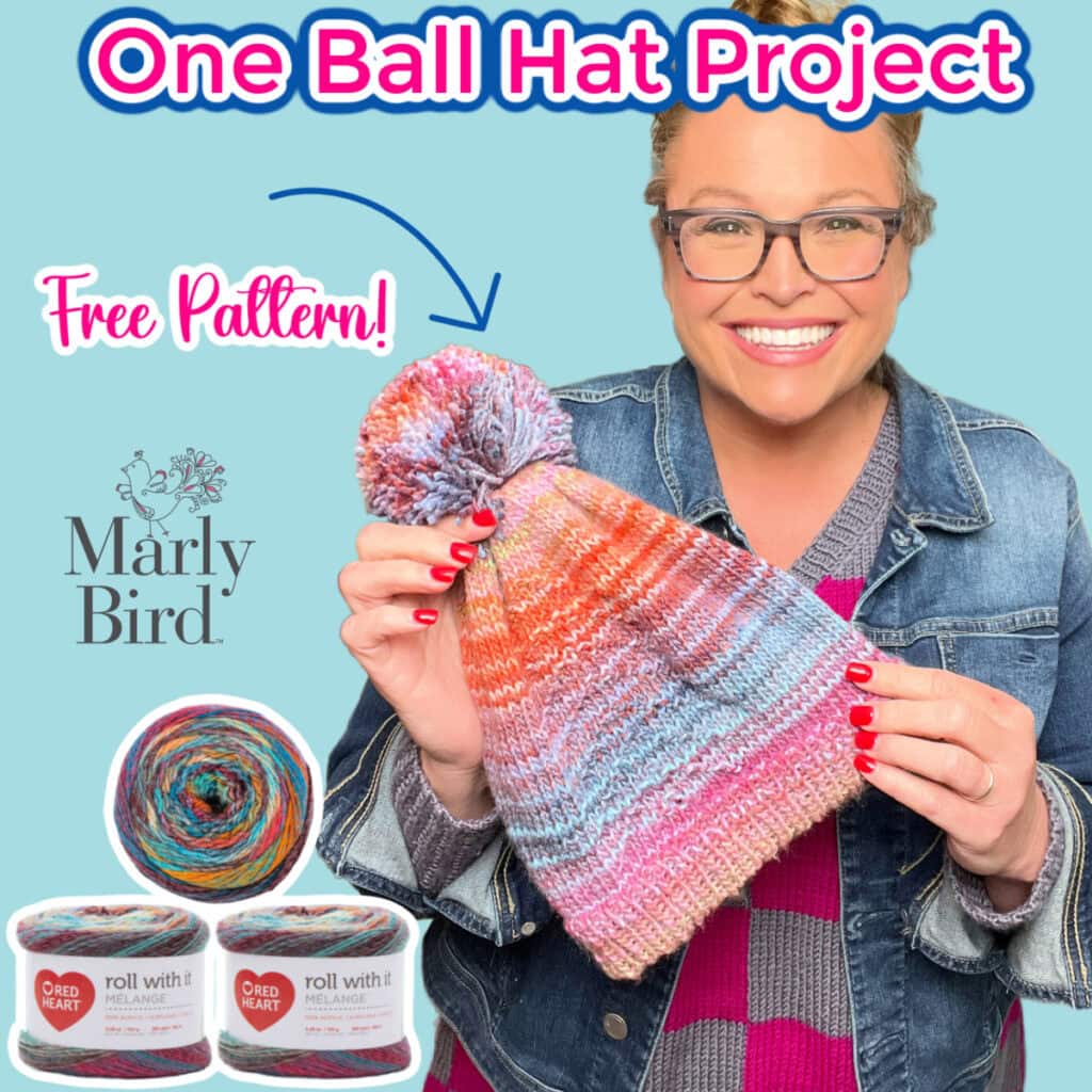 Smiling person in glasses and denim jacket holds a colorful knit hat with a pom-pom. Text reads “One Ball Hat Project” and “Free Pattern!” Gorgeous yarn skeins and the Marly Bird logo are shown at the bottom. -Marly Bird