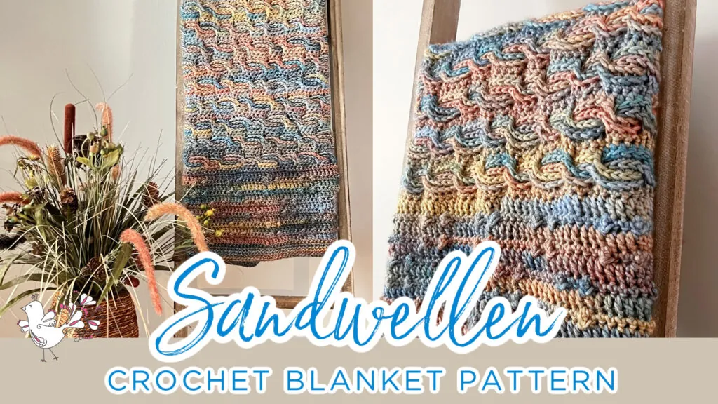 A multicolored crochet blanket with a textured wave pattern hangs on a wooden ladder, next to a vase of dried flowers. Text reads: "Sandwellen Crochet Blanket Pattern" with a small bird illustration. -Marly Bird