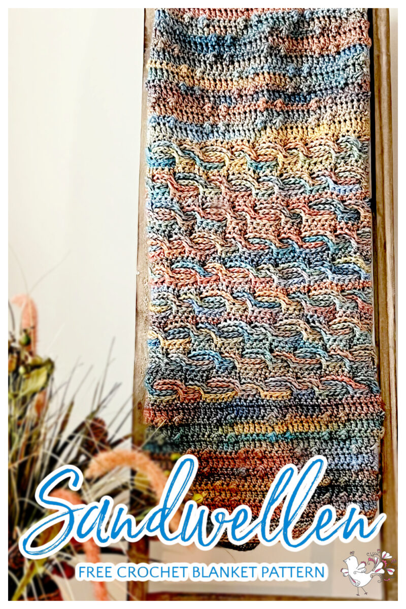 Sandwellen Free Crochet Blanket Pattern with crochet bobbles and horizontal crochet cables - Marly Bird