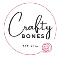 Logo for "Crafty Bones" with "EST 2016" below, inside a pink hand-drawn circle. A pink ball of yarn, perfect for 24 days of quickies projects, sits at the bottom right with a playful trailing strand. -Marly Bird