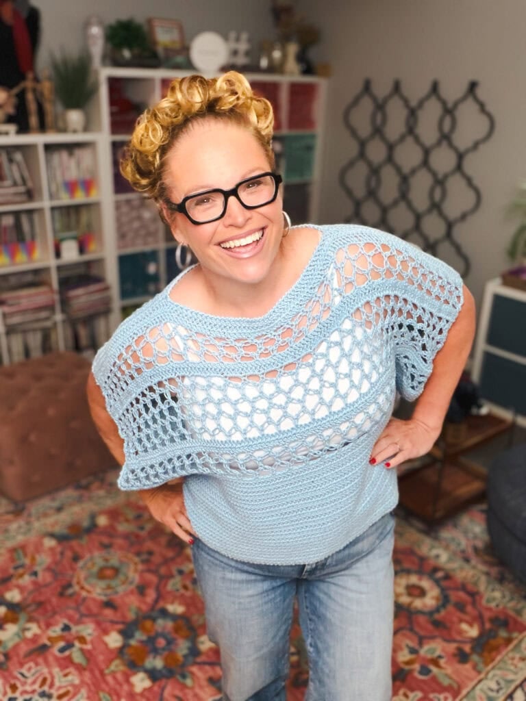 Solomon's Knot Crochet Tee styled with denim showing the open Solomon's Knot stitch sleeves and oversized drape
