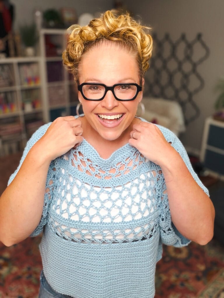 Marly Bird modeling the Solomon's Knot Crochet Tee in Bernat Softee Cotton, showing the airy Solomon's Knot stitch sleeves and oversized fit — free crochet tee pattern