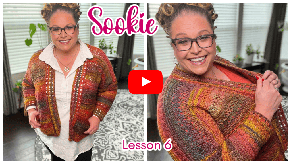 A woman wearing glasses and a colorful crochet cardigan smiles in two side-by-side images. Text reads "Sookie" and "Lesson 6," with a YouTube play button at the center. The cozy indoor setting, featuring plants and a patterned rug, adds the perfect finishing touches to the scene. -Marly Bird