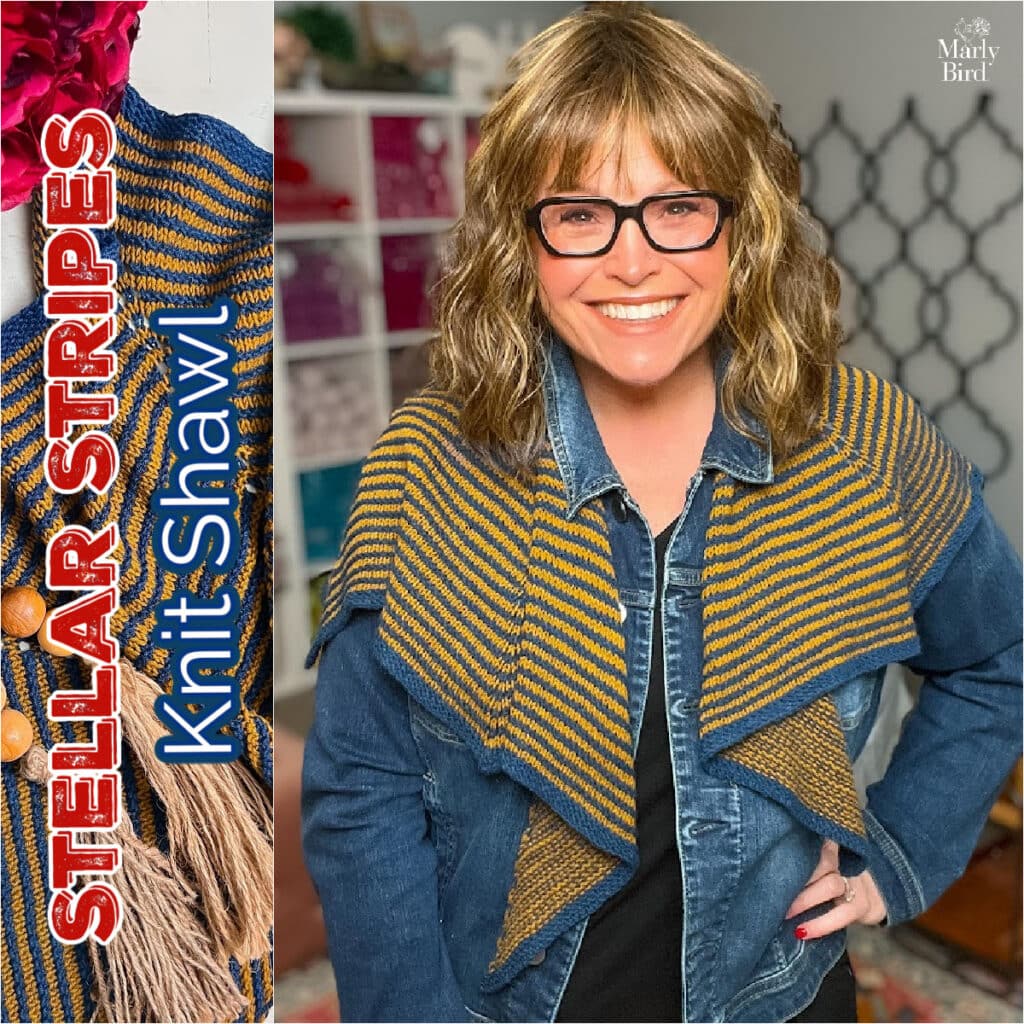 Woman models a blue and yellow striped knit shawl with visible stitch detail; yarn and cozy decor in the background.