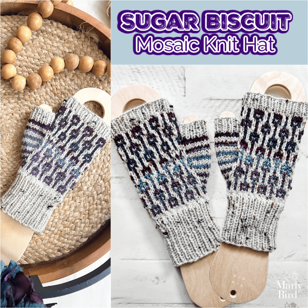 A pair of hand-knit fingerless gloves made with the Sugar Biscuit Knit Fingerless Mitts Pattern by Marly Bird features a mosaic motif in purple, blue, and cream on wooden sock blockers. A beaded garland adds a charming accent. -Marly Bird