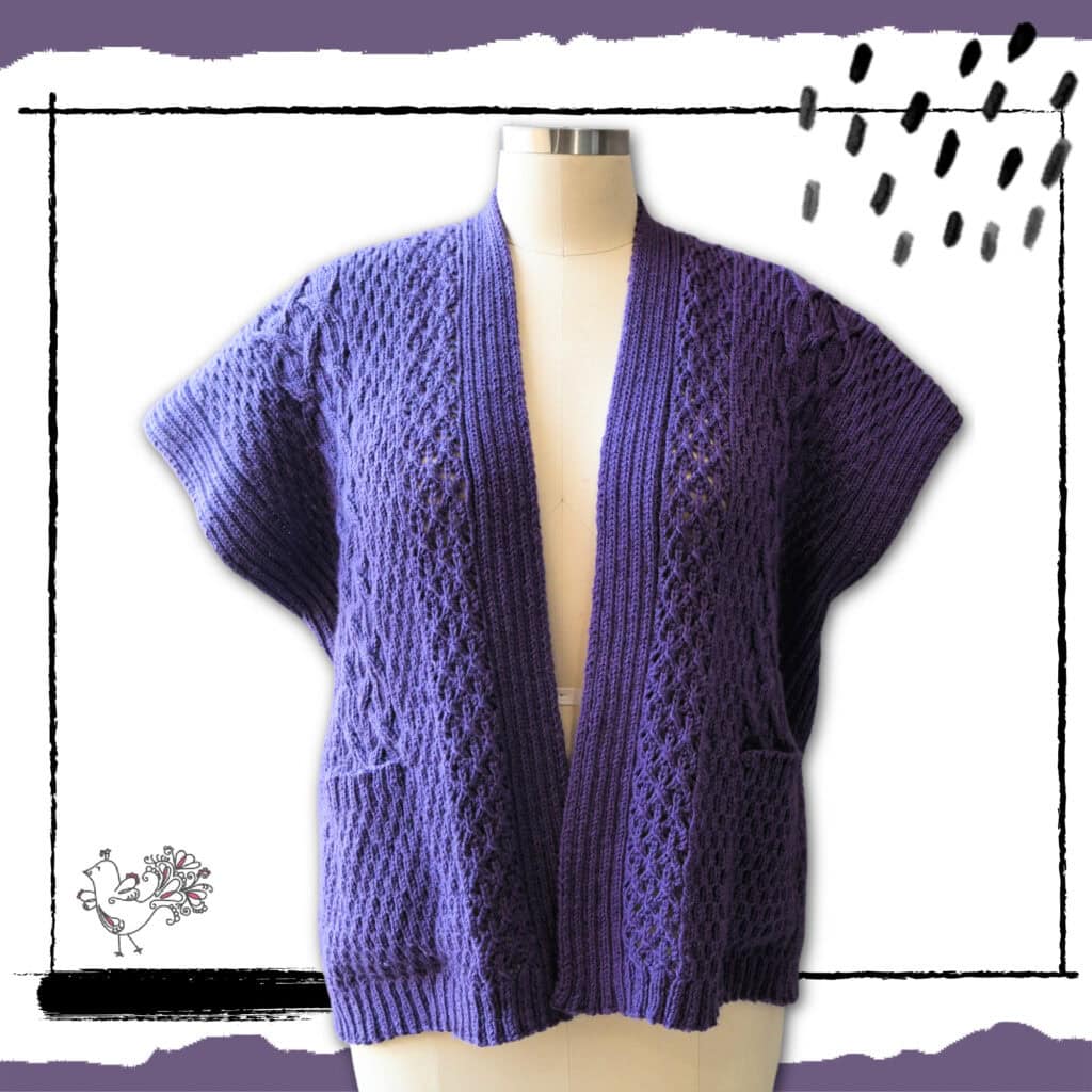 A purple, short-sleeved, open-front knit cardigan with textured patterns and two front pockets is displayed on a dress form. This design is available in both knit and crochet versions of the same pattern. Hand-drawn black lines and doodles adorn the background. -Marly Bird