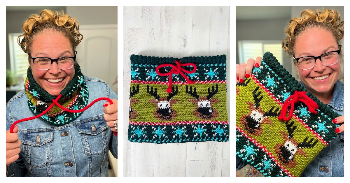 A smiling person with glasses and curly hair wears and displays a colorful Vixen's Vibe crochet cowl with reindeer and snowflake patterns, completed with a red drawstring and neat final edging. -Marly Bird