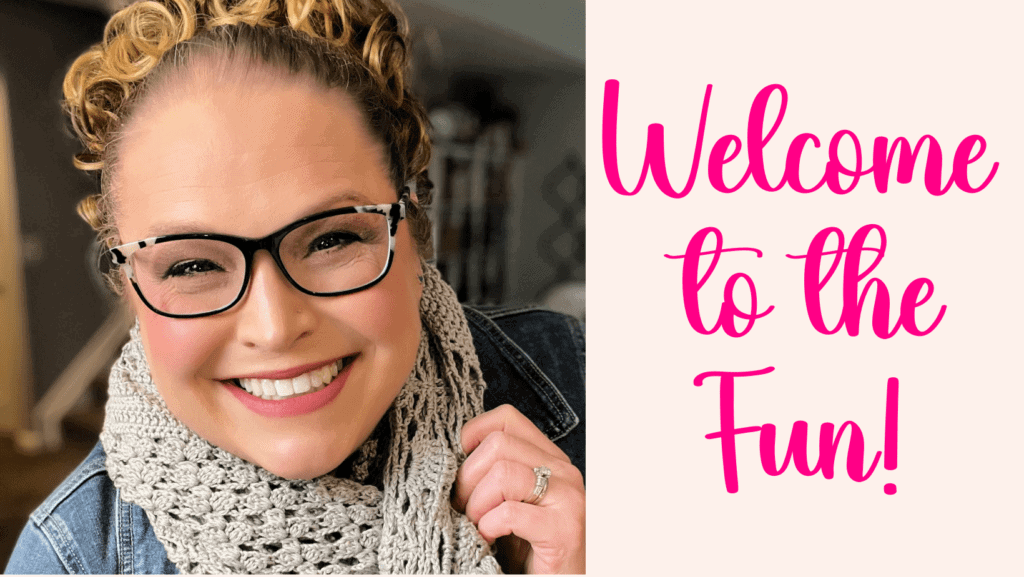 A person with glasses smiles warmly, wearing a crocheted scarf and a denim jacket. The right side of the image features pink text saying, "Welcome to the Fun!"—the perfect vibe for those cozy make-along fall weekends. -Marly Bird