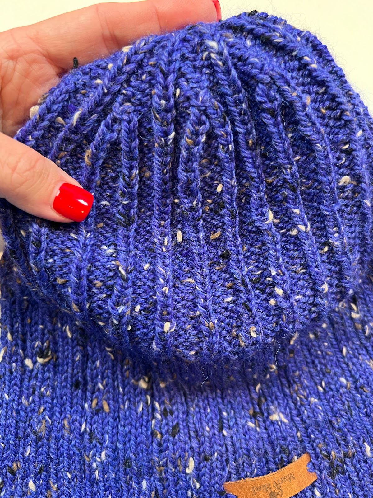 Close up of the Every Day Knit Hat inside out to see the crown shaping. The center double decreases use allow for distinct columns of knits to form on the inside of the hat - Marly Bird